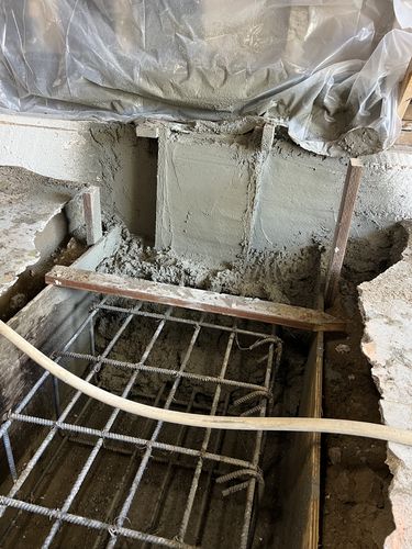 Freshly poured concrete pier footing