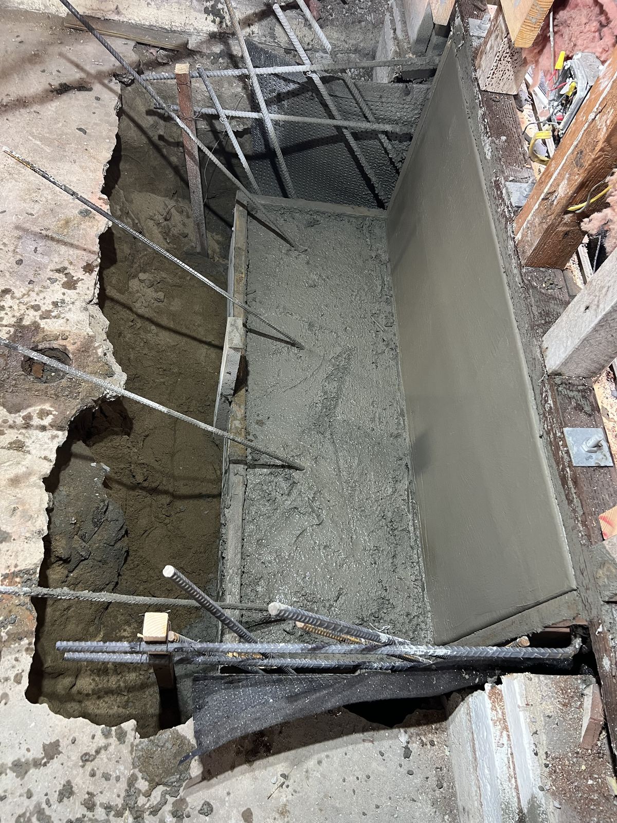 Cured and finished concrete foundation wall